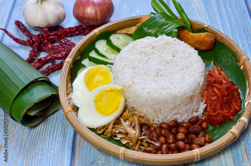 Nasi Lemak is commonly found food in Malaysia, Brunei and Singapore. It is an unofficial national food in Malaysia. Selective focus.