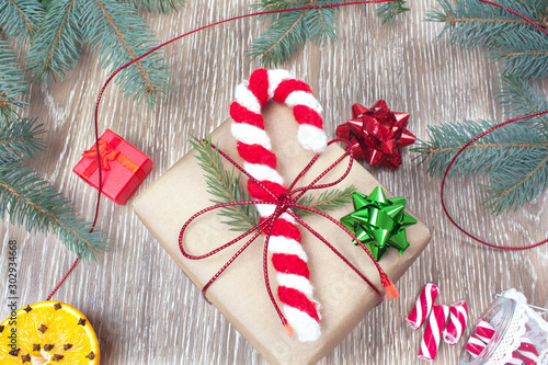 Fototapeta Naklejka Na Ścianę i Meble -  Candy cane Santa knitted amigurumi Christmas ornaments