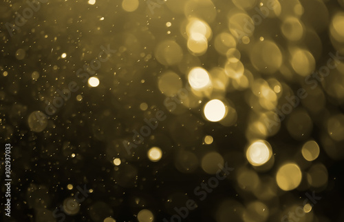 Abstract golden bokeh on black background