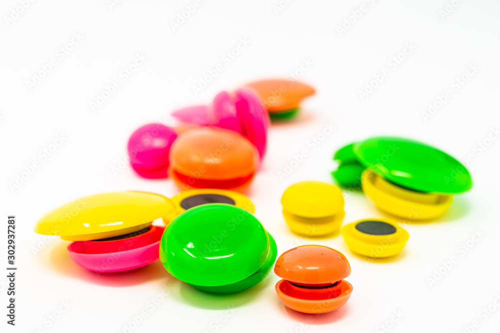 colored round magnets isolated on white background colored round magnets isolated on white background