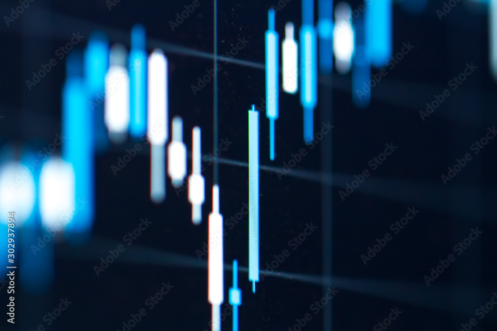 Forex chart on screen of laptop. Stock finance business diagram on display. Bars of trading chart