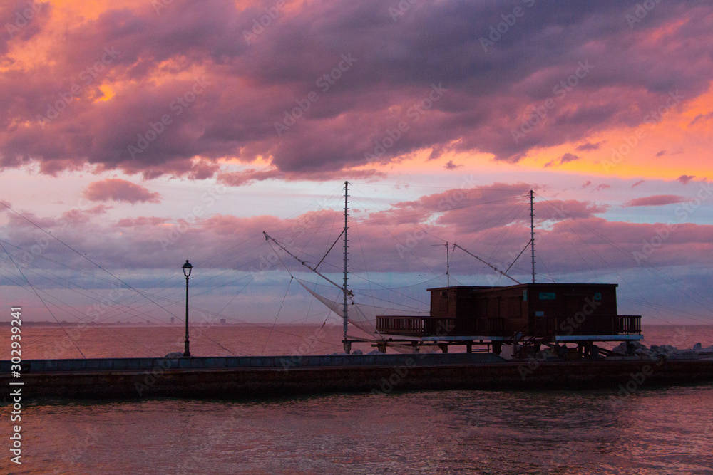Sunset on the sea, fisher house, cesenatico italy Sunset on the sea, fisher house, cesenatico italy