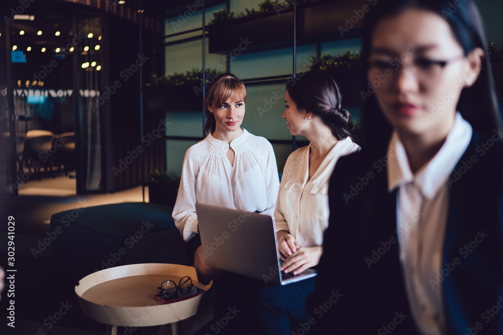 Coworking modern businesswomen with laptop