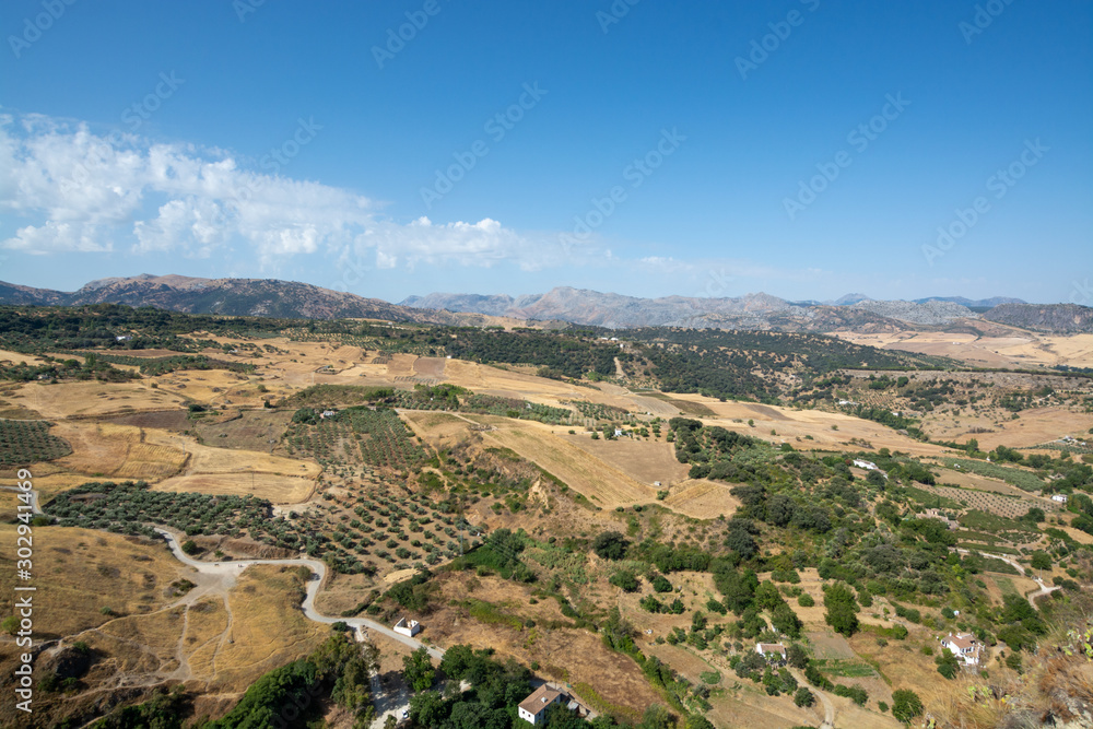 Scenic viewpoint to valley and mountains from Ronda, small ancient white town in Andalusia, Spain
