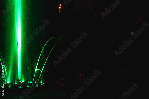 Ukraine. Kyiv - 05.06.2019 Amazing dancing fountain in the night illumination of rainbow color with colorful illuminations on the lake.