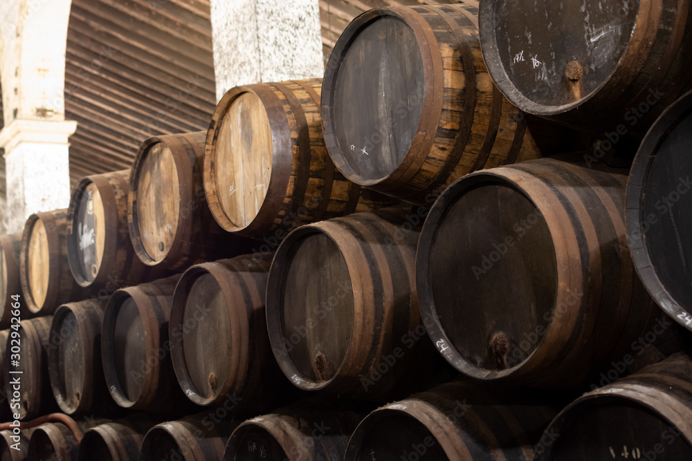 Production of fortified jerez, xeres, sherry wines in old oak barrels in sherry triangle, Jerez la Frontera, El Puerto Santa Maria and Sanlucar Barrameda Andalusia, Spain