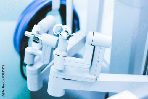 hands of a surgeon at a computer robot, joystick control. Medical robot. Robotic surgery, operating room.