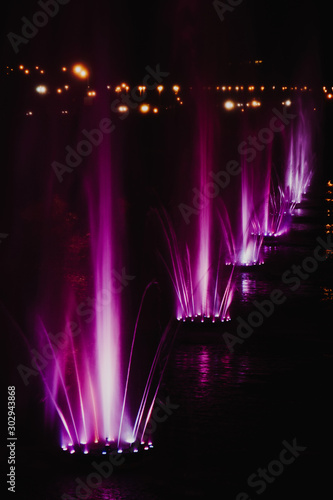 Fototapeta Naklejka Na Ścianę i Meble -  Ukraine. Kyiv - 05.06.2019 Amazing dancing fountain in the night illumination of rainbow color with colorful illuminations on the lake.