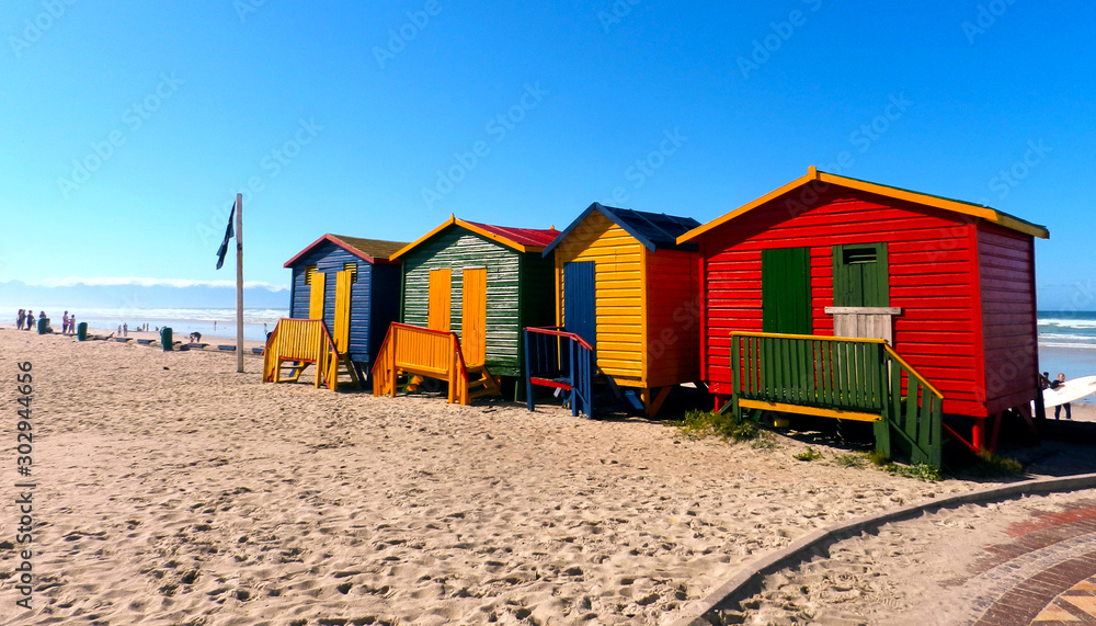 Colourful changing huts on the beach front Colourful changing huts on the beach front