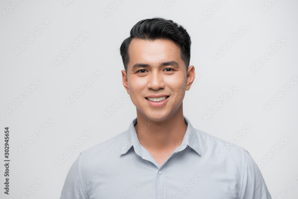 Young good looking asian business man on a white background isolated Young good looking asian business man on a white background isolated