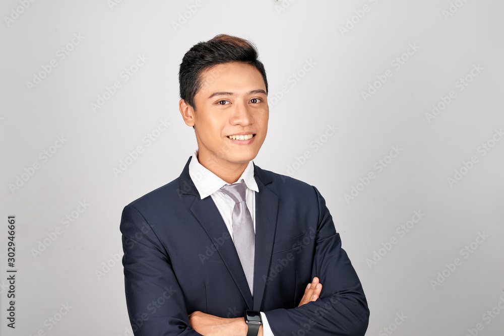 Close up portrait of an attractive young businessman smiling Close up portrait of an attractive young businessman smiling