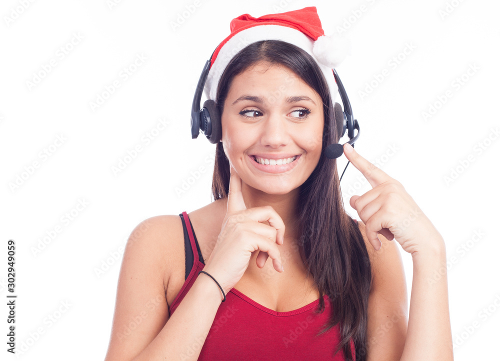 Christmas headset woman from telemarketing call center wearing red santa hat talking smiling isolated on white background. Christmas headset woman from telemarketing call center wearing red santa hat talking smiling isolated on white background.