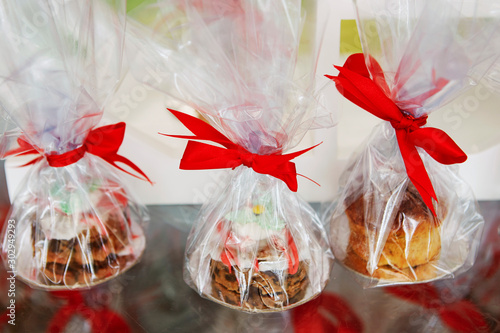 Christmas dessert, wrapped with red ribbon 