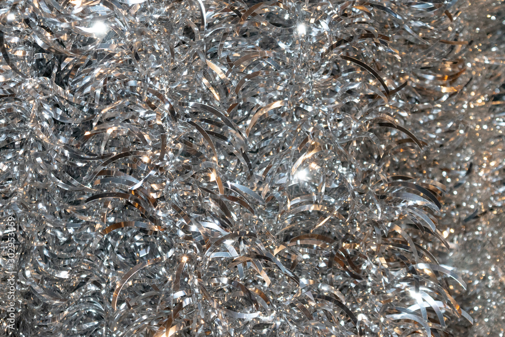 Shiny glitter background with silver tinsel macro texture. Shiny glitter background with silver tinsel macro texture.
