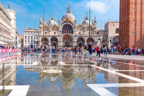 Cathedral Basilica of Saint Mark and Piazza San Marco, St Mark Square, deluged by flood water during Acqua alta which means High water, Venice, Italy © Kavalenkava