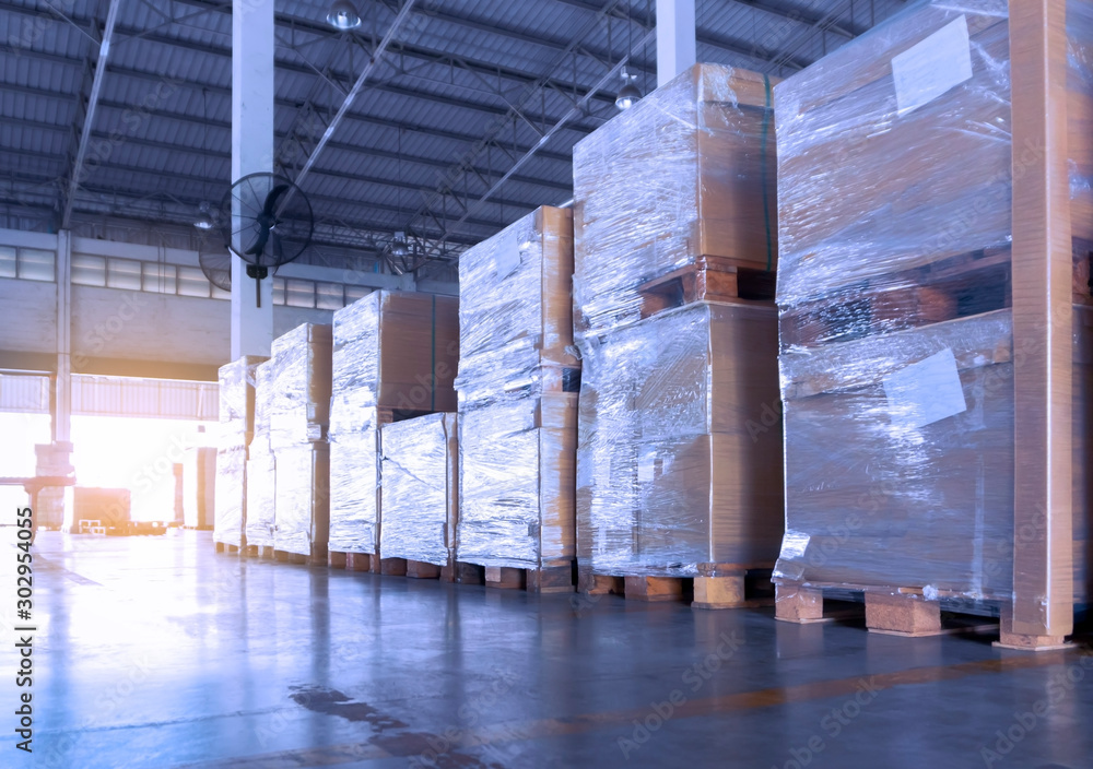 Fototapeta premium Stack of heavy shipment goods in interior of storage warehouse.