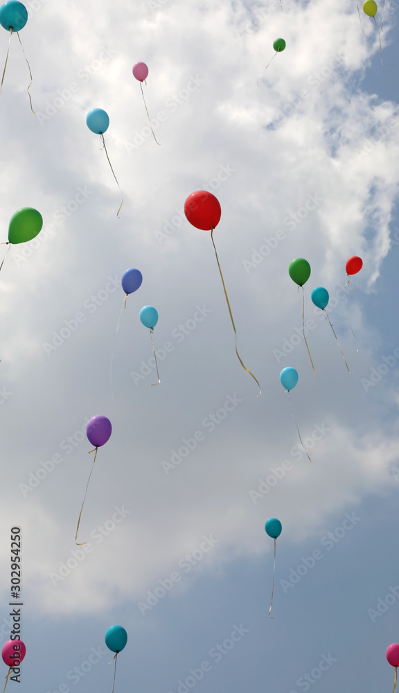 many colorful balloons on the air