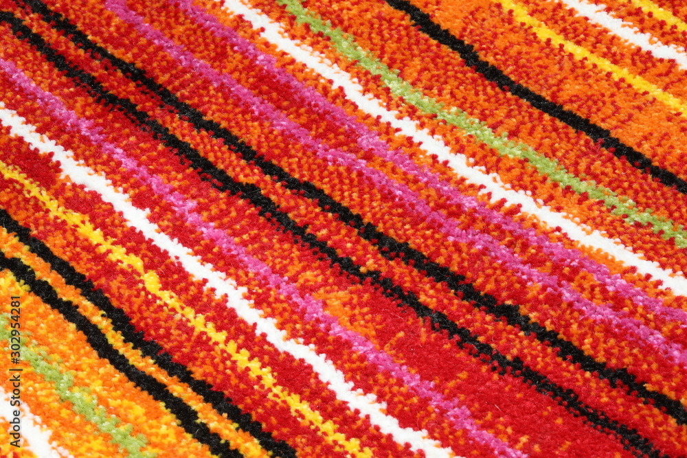 background of a carpet with oblique colored lines