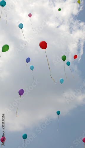 many colorful balloons on the air