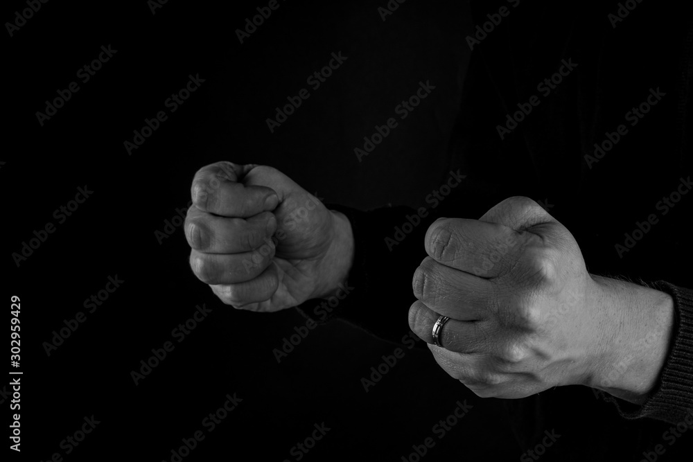 German Good Luck Gesture, man holding thumbs wishing luck. black and white , copy space