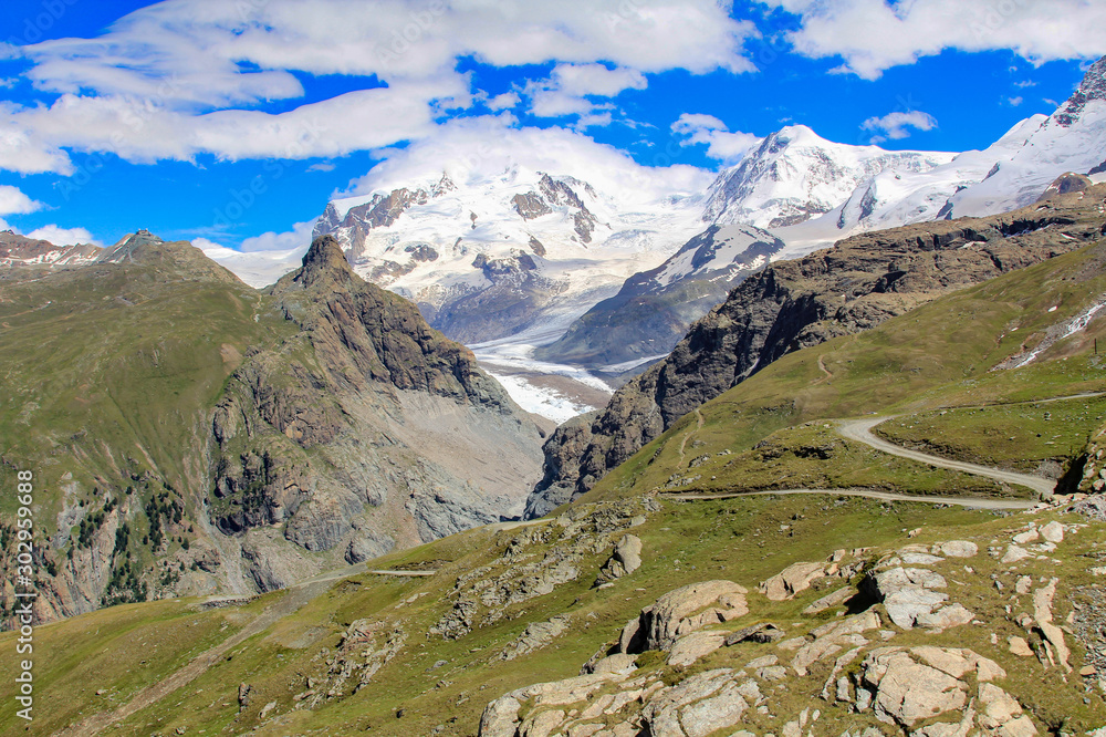 Swiss Alps with natural mountain glacier in the daytime Swiss Alps with natural mountain glacier in the daytime