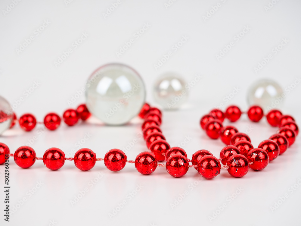 red beads transparent ball lie on a white background red beads transparent ball lie on a white background