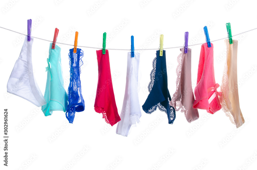 female panties on clothespins rope on white background isolation - obrazy, fototapety, plakaty 