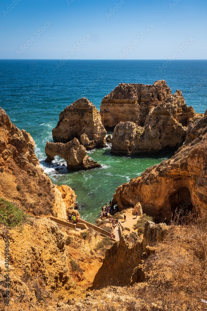 Coastal cliffs and sea stacks near Ponta da Piedate, Lagos, Portugal.
