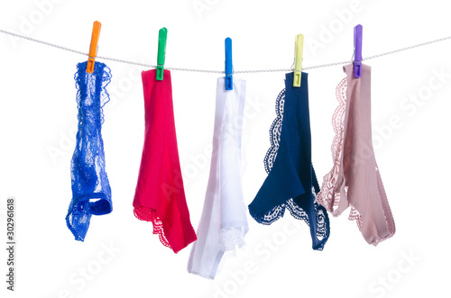 female panties on clothespins rope on white background isolation