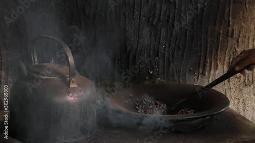 Rural Bali coffee preparation, cooking coffee beans, Luwak