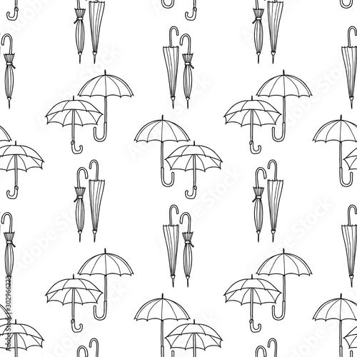 Seamless pattern of drawn open and closed umbrellas