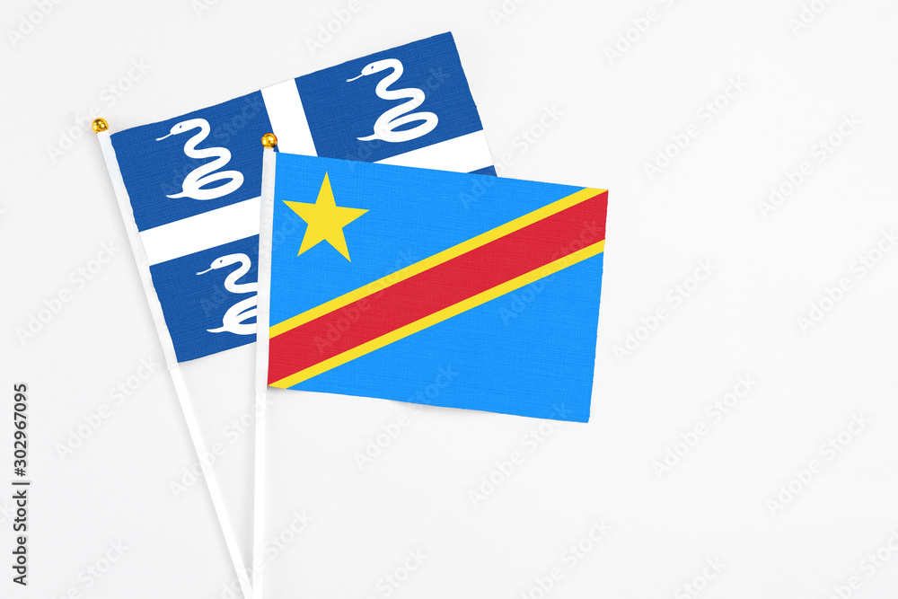 Congo and Martinique stick flags on white background. High quality fabric, miniature national flag. Peaceful global concept.White floor for copy space. Congo and Martinique stick flags on white background. High quality fabric, miniature national flag. Peaceful global concept.White floor for copy space.