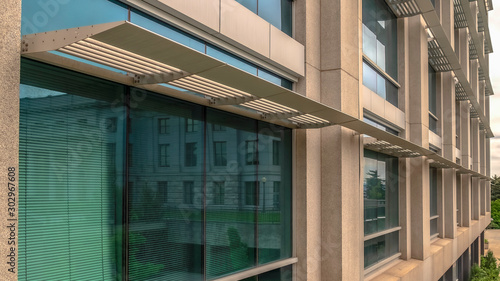 Wallpaper Mural Panorama frame Office building exterior with close up on the glass windows and concrete wall Torontodigital.ca