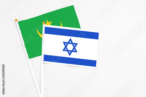 Free Download Israel and Mauritania stick flags on white background. High quality fabric, miniature national flag. Peaceful global concept.White floor for copy space. - GFXLoad