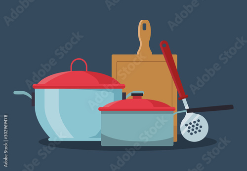 kitchen pots with chopping board and skimmer