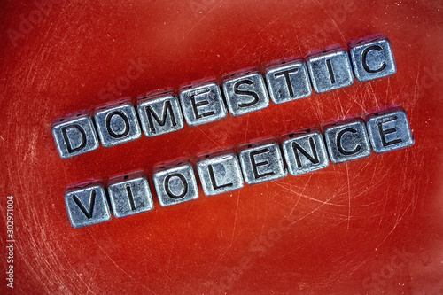 Domestric violence background concept with cubic metal letters photo