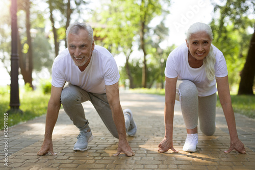 Delighted man and woman waiting for running stock photo photo