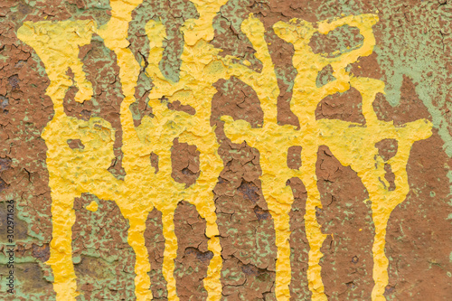 close up of damaged concrete with yellow and green color covered.    © Thipphawan