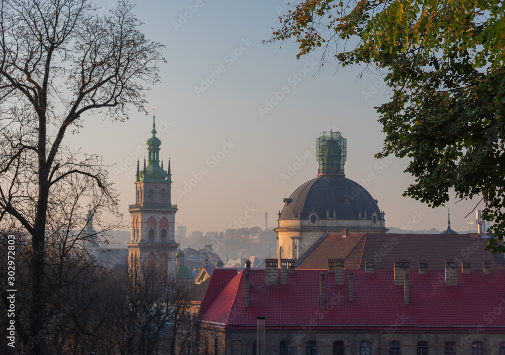 Morning view of the beautiful city of Lviv, with the town hall, ancient fire department and churches in autumn
