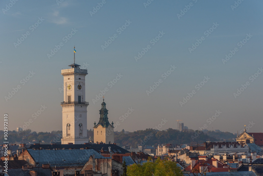 Morning view of the beautiful city of Lviv, with the town hall, ancient fire department and churches in autumn