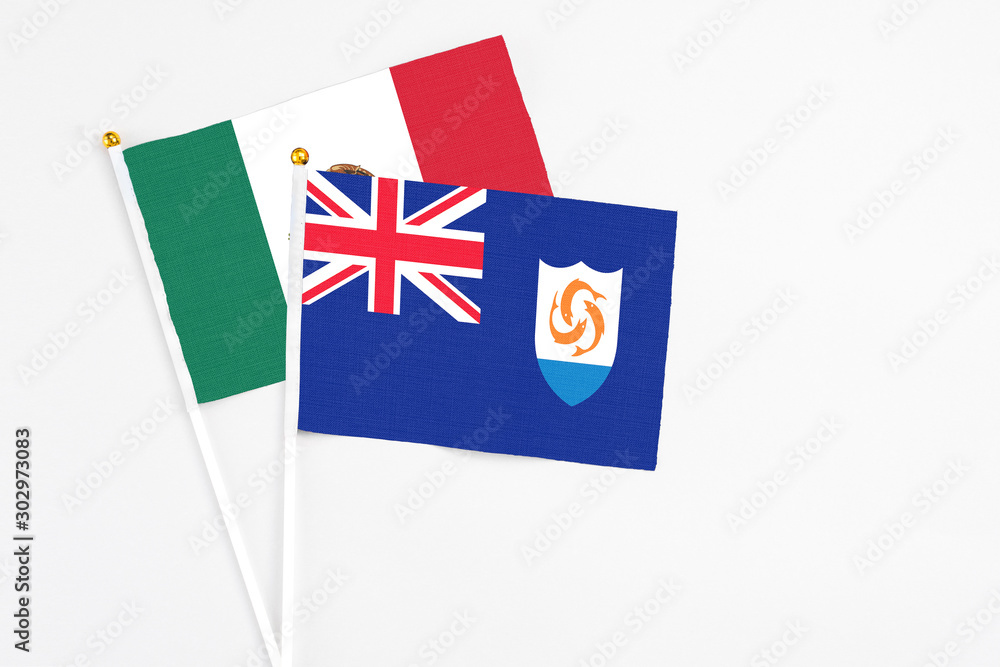Anguilla and Mexico stick flags on white background. High quality fabric, miniature national flag. Peaceful global concept.White floor for copy space.