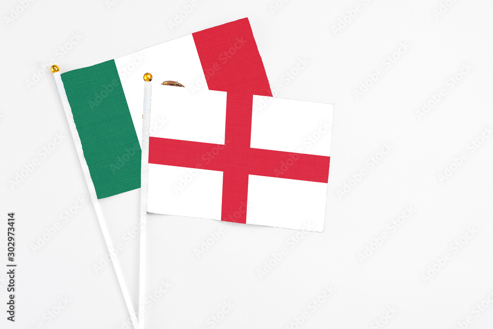 England and Mexico stick flags on white background. High quality fabric, miniature national flag. Peaceful global concept.White floor for copy space.