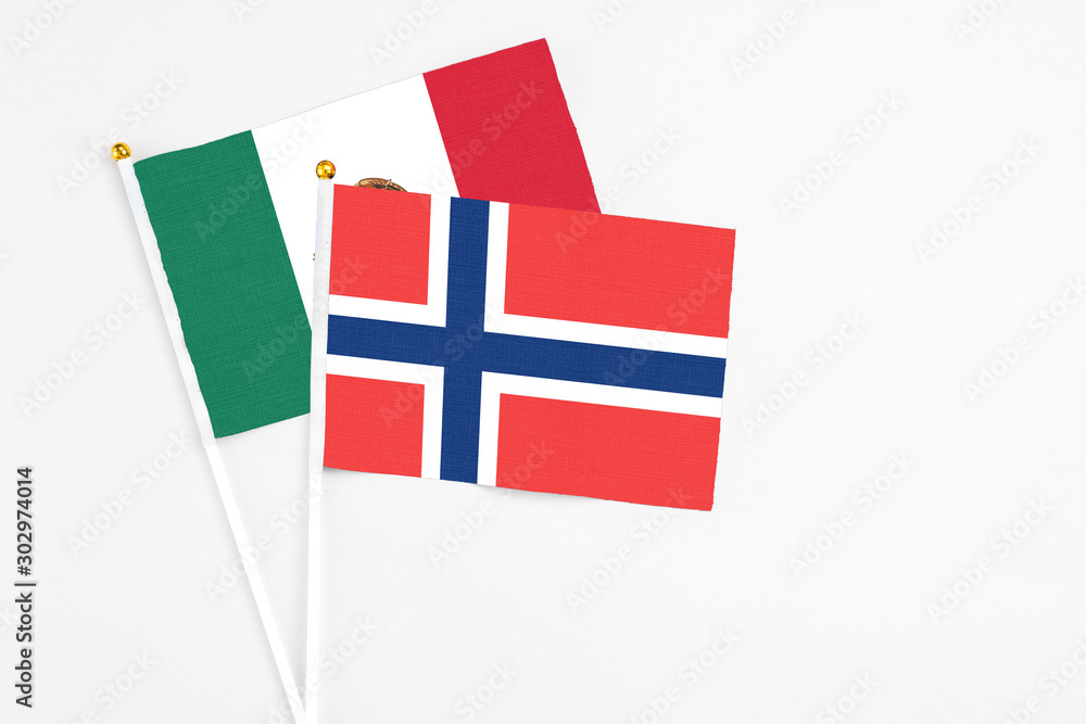 Norway and Mexico stick flags on white background. High quality fabric, miniature national flag. Peaceful global concept.White floor for copy space. Norway and Mexico stick flags on white background. High quality fabric, miniature national flag. Peaceful global concept.White floor for copy space.