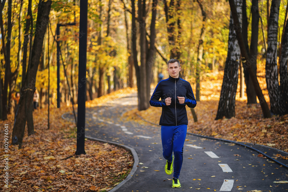 Fototapeta premium young man running in the park