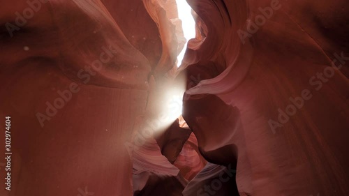 Antelope Canyon With Wavy And Smooth Stone Walls Of Red Color And Sun Ray Shines