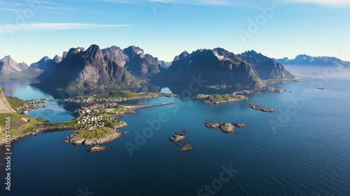 aerial view. flight over the sea,view on Reine and Hamnoya village .the Camera move right to left .Lofoten Islands,Norway.Camera move right to left