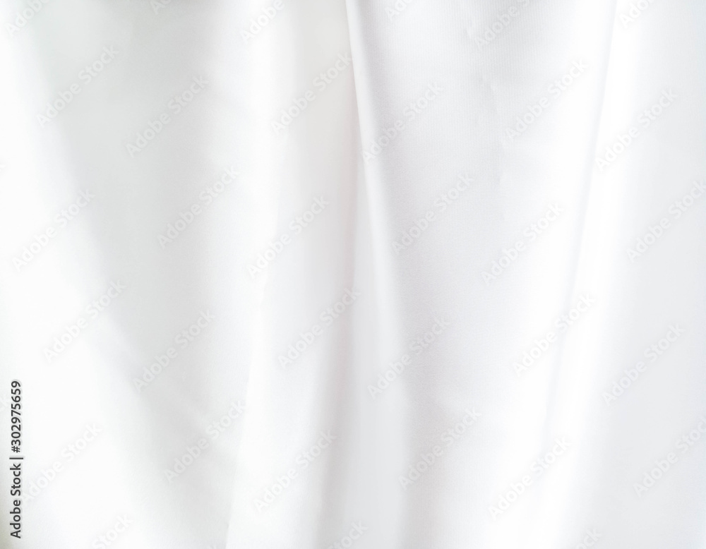 The luxury of white fabric wave texture background The luxury of white fabric wave texture background