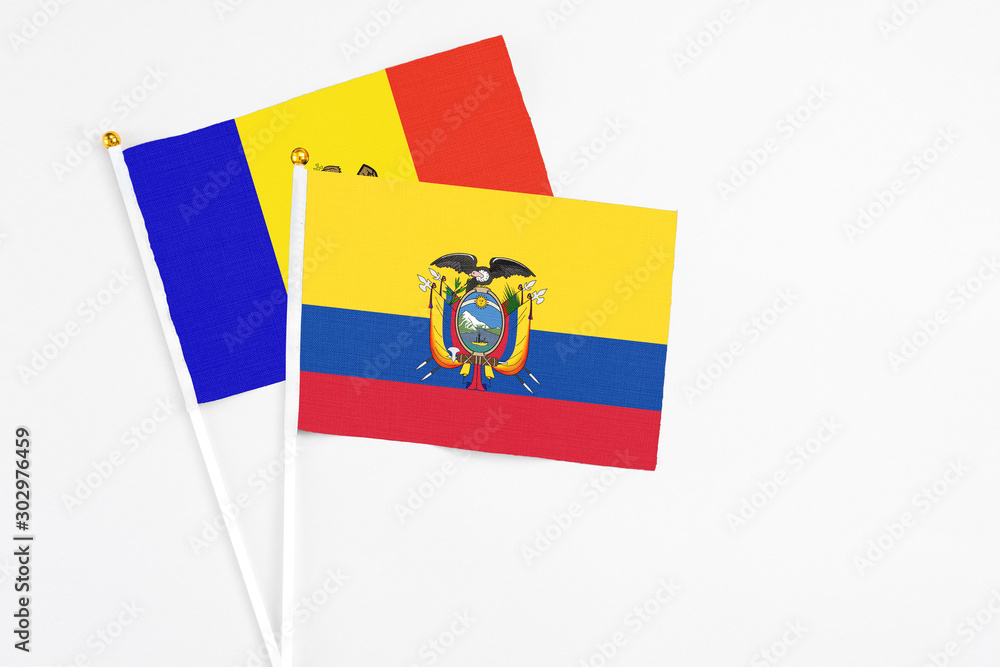 Fototapeta premium Ecuador and Moldova stick flags on white background. High quality fabric, miniature national flag. Peaceful global concept.White floor for copy space.