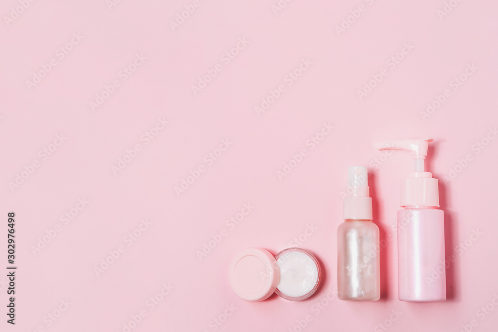 Cosmetic bottle containers on pink color background. Cosmetic bottle containers on pink color background.