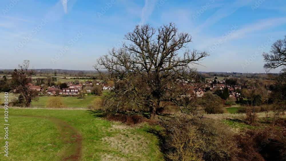 Aerial View Historic English Village Warwickshire Viewed Through Trees, In Winter, Pan Right To Left And Left To Right Stoneleigh Aerial View Historic English Village Warwickshire Viewed Through Trees, In Winter, Pan Right To Left And Left To Right Stoneleigh
